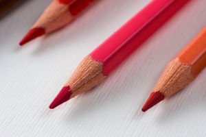 Three sharp red pencils.